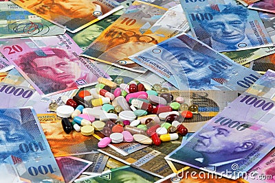 Swiss francs and tablets Stock Photo