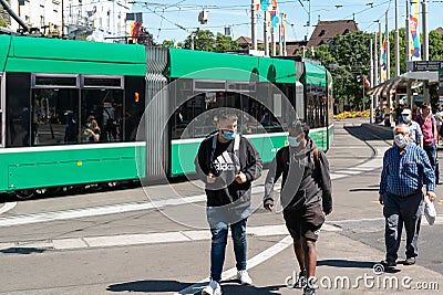 Swiss government regulations require travellers to wear face masks when using public transport Editorial Stock Photo