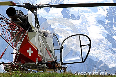 Swiss helicopter in the mounts of Bernese Oberland Stock Photo