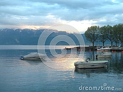 Swiss Lake sunset over mountains Editorial Stock Photo