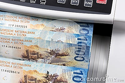 Swiss money in a counting machine Stock Photo