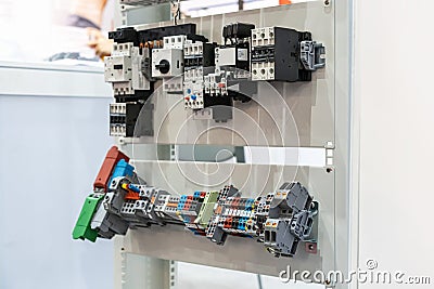 Switch contactor overload relay for control circuit voltage of motor or machine and rail relay socket with terminal block and Stock Photo