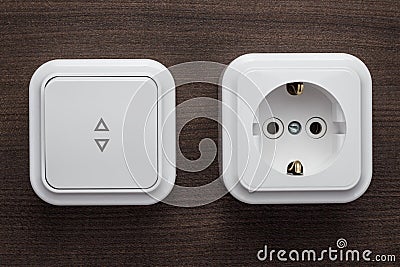 Switch and outlet on the wall Stock Photo