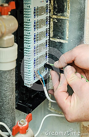 Switching signal wires in the home`s heating system control. Stock Photo