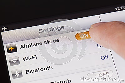 Switching to Airplane mode on an iPad Editorial Stock Photo