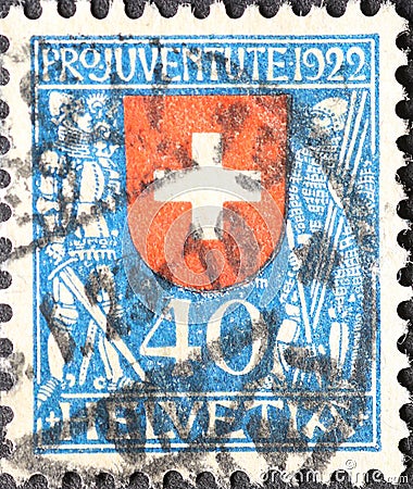 Switzerland - Circa 1922: a postage stamp printed in the Switzerland showing the federal coat of arms of Switzerland with shield h Editorial Stock Photo