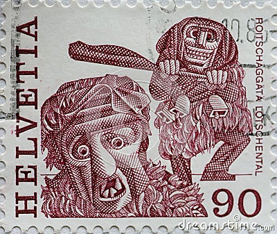 Switzerland - Circa 1977 : a postage stamp printed in the swiss showing a New Year`s Eve costume, RoitschÃ¤ggÃ¤tÃ¤ LÃ¶tschenta Editorial Stock Photo