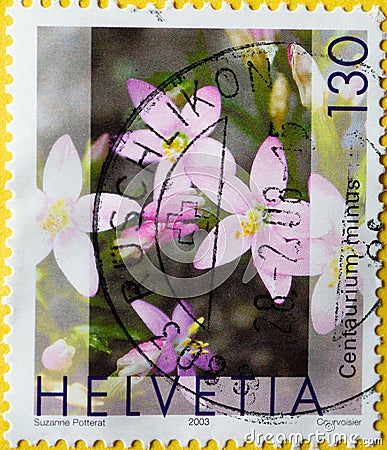 Switzerland - Circa 2003 : a postage stamp printed in the swiss showing some flowers of the centaury medicinal plant. Text: Centau Editorial Stock Photo