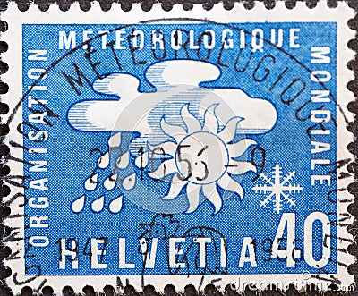 Switzerland - Circa 1957 : a postage stamp printed in the swiss showing World Meteorological Organization OMM / WMO Weather elem Editorial Stock Photo