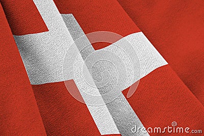Switzerland flag with big folds waving close up under the studio light indoors. The official symbols and colors in Stock Photo