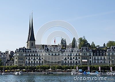 Grand Hotel National Luzern and Hofkirche St. Leodegar Editorial Stock Photo