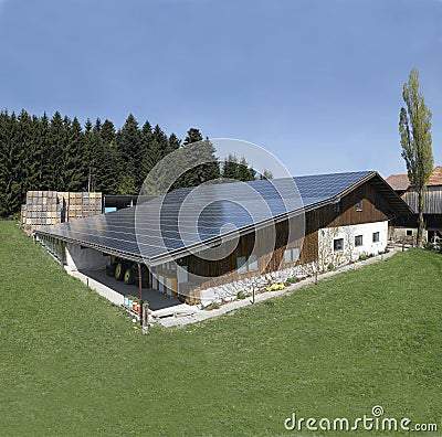 Switzerland: Solrenergy-panel on the roof of a farmhouse. Editorial Stock Photo