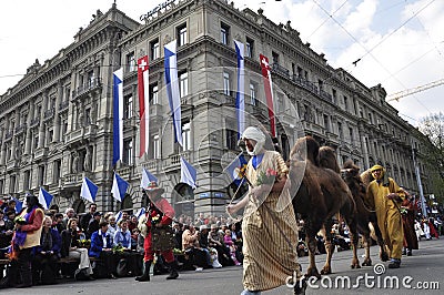 Three camels joining the traditional SechselÃ¤uten-Parade crossing ZÃ¼richs Paradeplatz Editorial Stock Photo