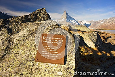 Switzerland, Zermatt, October 19, 2018: Psalm Bible Memorial Tablet for Tourists The clear water of the mountain lake Stellisee Editorial Stock Photo