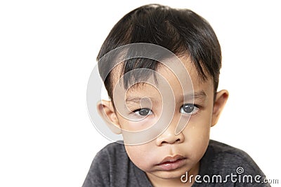 Swollen face of asian kid suffering from health problem and aching tooth Stock Photo