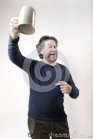 swooping nordic man toasting with beer mug Stock Photo