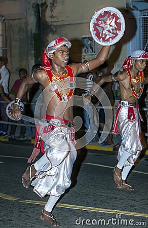 Sword Dancers perform along the streets of Kandy during the Esala Perahera in Sri Lanka. Editorial Stock Photo