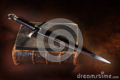 Book and sword Stock Photo