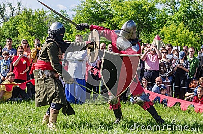 The swordfight heavily armed medieval warriors Editorial Stock Photo