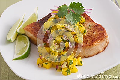 Swordfish with mango salsa Stock Photo