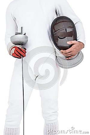 Swordsman holding fencing mask and sword Stock Photo