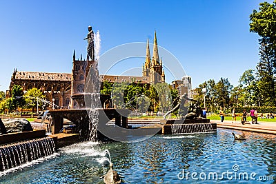 Sydney, Australia - 2019. Archibald Memorial Fountain in Hyde Park, Theseus conquering the Minotaur & Cathedral Editorial Stock Photo