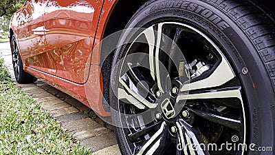 Close-up low angle view of the back wheel of a Honda Civic Editorial Stock Photo