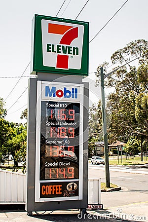 Entrance to 7 Eleven petrol service station and fuel prices Editorial Stock Photo