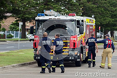 Fire and Rescue New South Wales crew returning to their fire truck Editorial Stock Photo