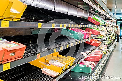 Half empty meat aisle shelf at Aldi Supermarket. Meat shortage due to COVID-19 Omicron outbreak in Editorial Stock Photo