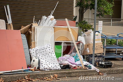 Household miscellaneous rubbish items put on curbside for council bulky waste collection Editorial Stock Photo