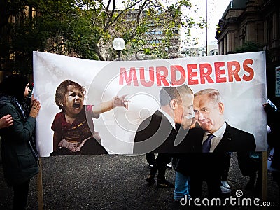 The protester show big poster says ` Murderers` with Image of president Obama and Israel presidents. Editorial Stock Photo