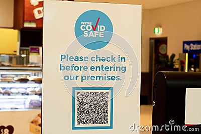 Mandatory COVID Safe QR-code check in and check out at all indoor venues in NSW. Sign with QR code in Editorial Stock Photo