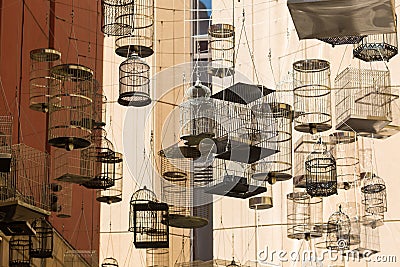 SYDNEY, AUSTRALIA - NOVEMBER 2, 2014: Forgotten Songs is an artistic installation of empty birdcages hanging in the sky on the a Editorial Stock Photo