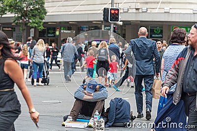 SYDNEY, AUSTRALIA - NOVEMBER 12, 2014: Homeless People in Sydney, Australia. Close to Town Hall, on George and Druitt Junction Editorial Stock Photo