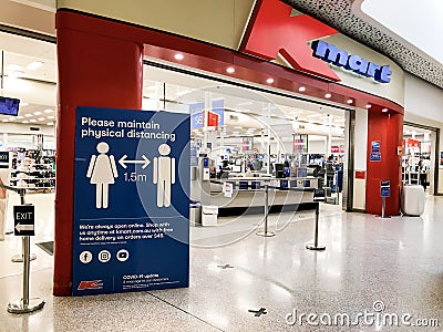 Sydney, Australia 2020-04-08: A sign about physical social distancing at the entrance to Kmart retail store during COVID-19 Editorial Stock Photo