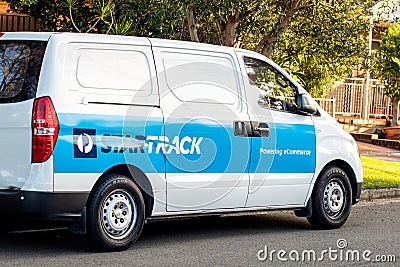 Star Track delivery van on a street. Star Track is delivery service ownded by Australia post Editorial Stock Photo