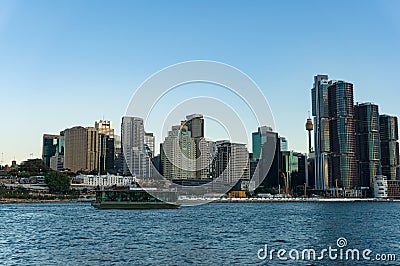 Sydney CBD cityscape with Barangaroo point and Koala cruises boat with tourists at dusk Editorial Stock Photo