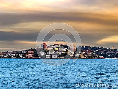 Sydney Harbour Australia at Sunset, lovely coloured skies boats ferries cruise liners houses and buildings Stock Photo