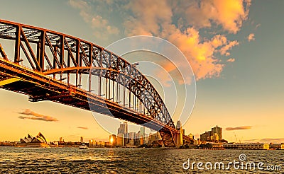 Sydney Harbour Bridge and Opera House at golden sunset Stock Photo