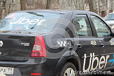 13.11.2020 Syktyvkar, Russia, Uber car brand Renault with the logo on the back window and on the side door on russian street Editorial Stock Photo