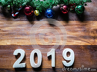 symbol Christmas Tree colorful, Is Number 2019 year on old wooden texture background Empty copy space for inscription design of h Stock Photo