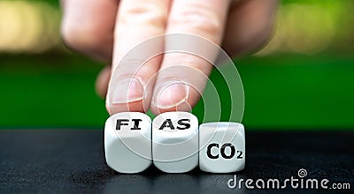 Symbol for failed CO2 reduction. Cubes form the expression 'fiasco' and 'co2'. Stock Photo