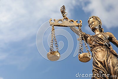 Symbol of fair treatment under law. Figure of Lady Justice against sky, low angle view with space for text Stock Photo