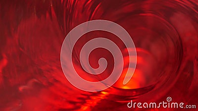 Symbol of hell, inferno and infinity. Red liquid hypnotic looped aqua swirl turning. Meditative luminous whirlpool. Mesmerising Stock Photo