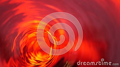 Symbol of hell, inferno and infinity. Red liquid hypnotic looped aqua swirl turning. Meditative luminous whirlpool. Mesmerising Stock Photo