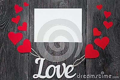 White letters Love with ropes and with red hearts, like balloons. space for text on a white sheet of paper. Stock Photo