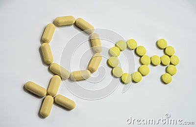 Symbol male and female formed with pills yellow Stock Photo