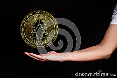 The symbol of the new popular cryptocurrency eosio with the image of hands Stock Photo