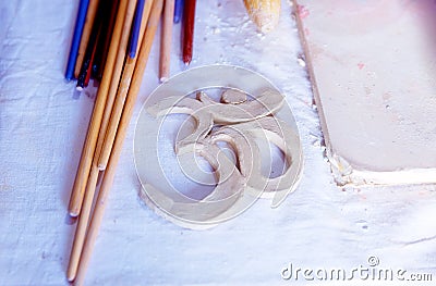 Symbol OM with clay on the desk. Stock Photo